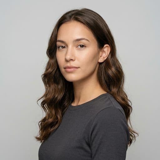 A woman with soft waves: Mid-length or long hair waved loosely, with the bend starting below the ear.