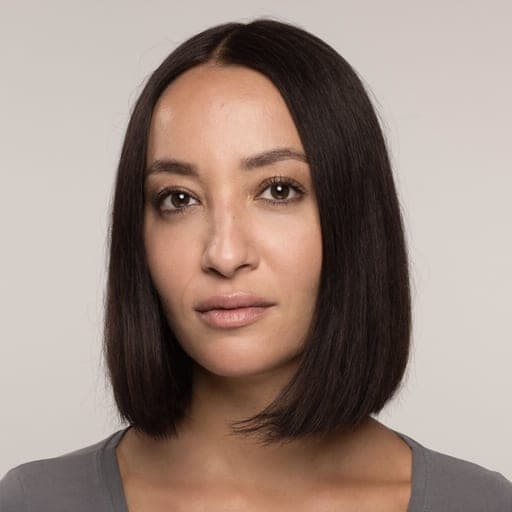 A woman with blunt lob: A long bob cut to one length, ending somewhere between the jaw and the collarbone.